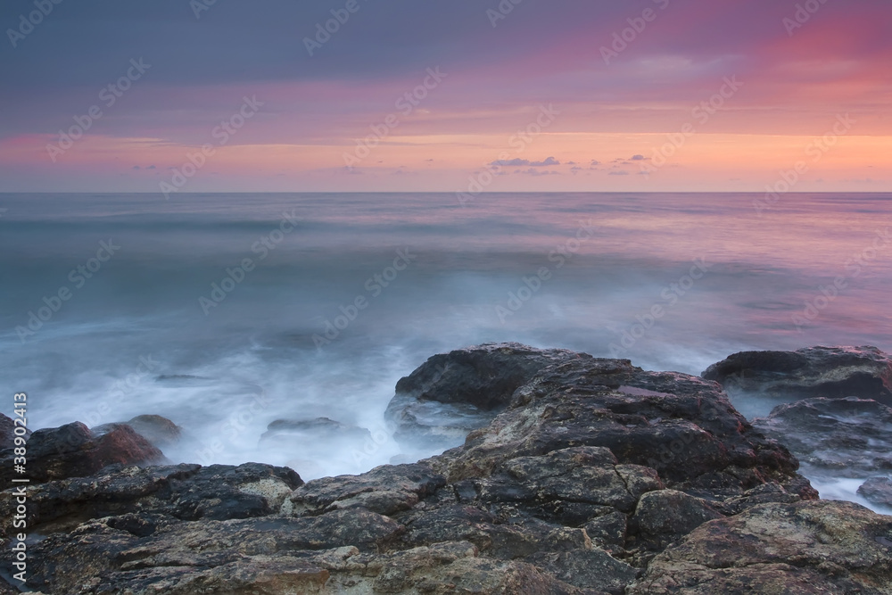Fototapeta premium Beautiful rocky sea beach at the sunset