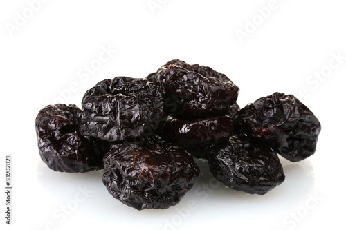 yummy dried plums isolated on white
