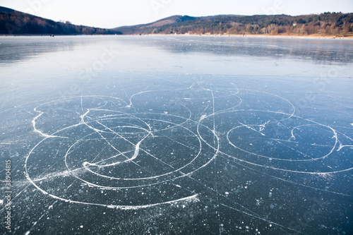 Ice skates trails on frozen lake, Brno dam