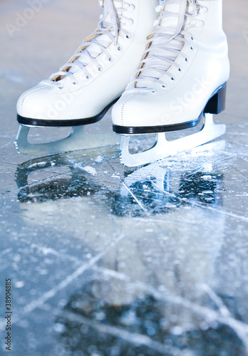 Portrait version, woman ice skates with reflection