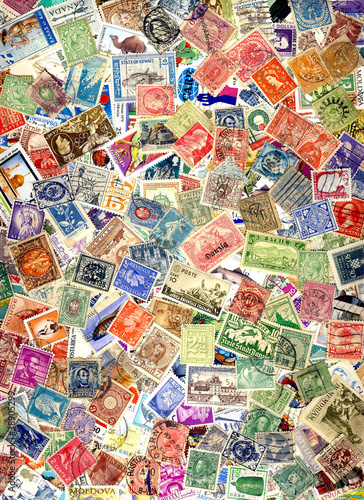 A pile of different postage stamps from around the world