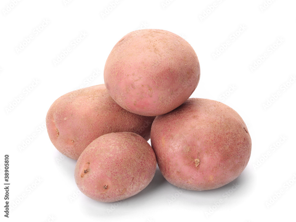 A small pile of potatoes pink isolated on white background A small pile of potatoes pink isolated on white background