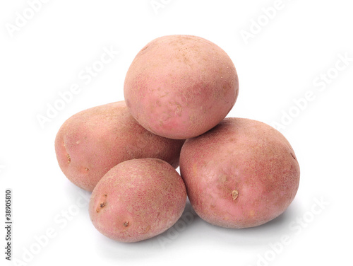 A small pile of potatoes pink isolated on white background