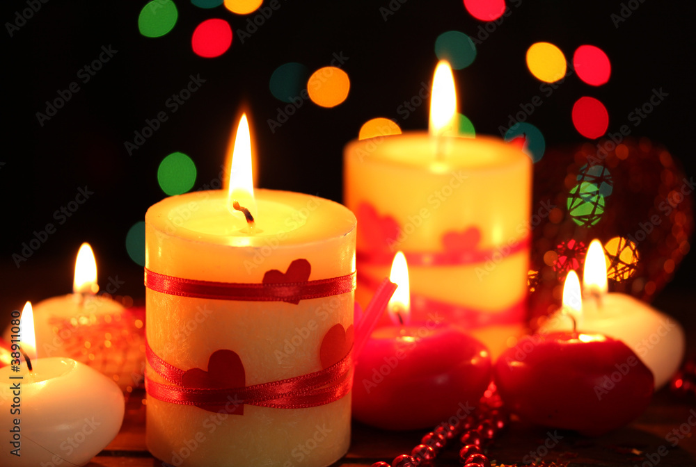 Beautiful candles on wooden table on bright background Beautiful candles on wooden table on bright background