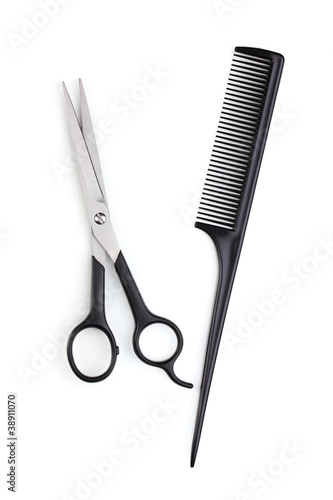 Hair cutting shears and comb isolated on white