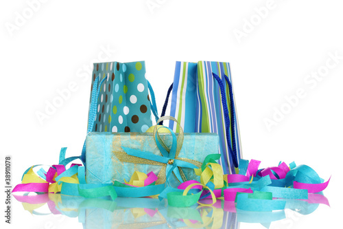 Colorful gift bags and gifts  with serpentine isolated on white