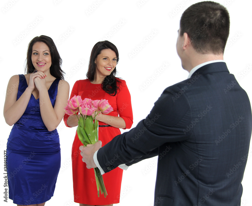 a man with a bouquet of flowers and two young women a man with a bouquet of flowers and two young women