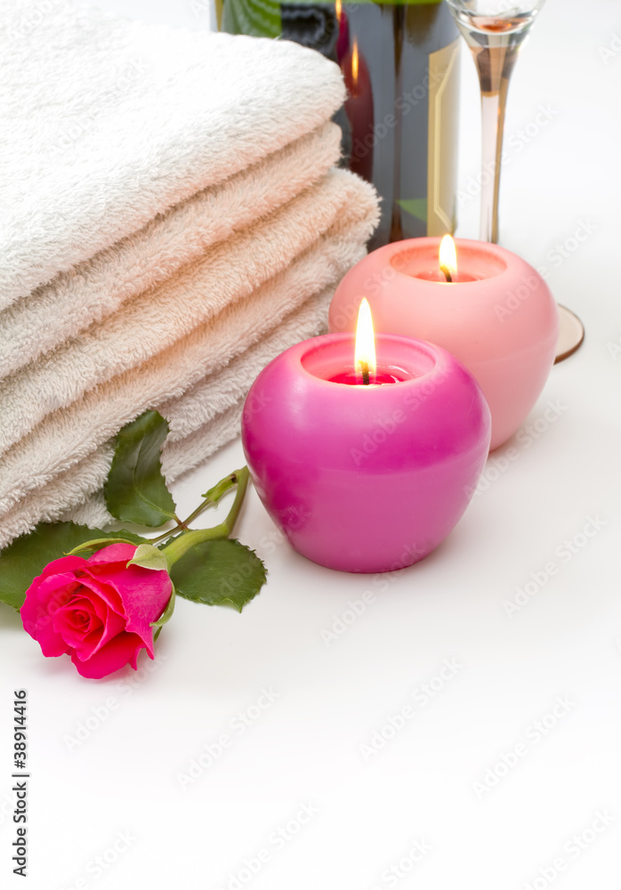 Towels candles rose and wine spa concept