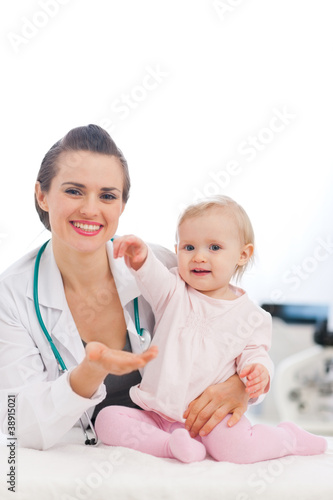 Lovely baby high five to pediatric doctor