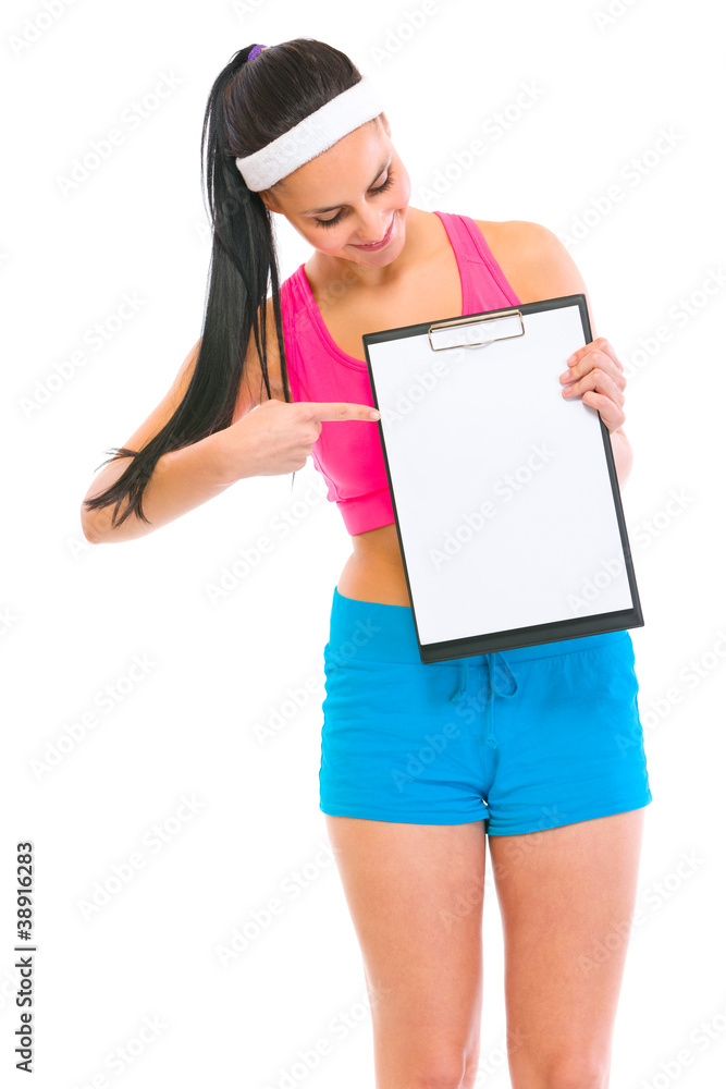 Slim girl pointing on blank clipboard Slim girl pointing on blank clipboard