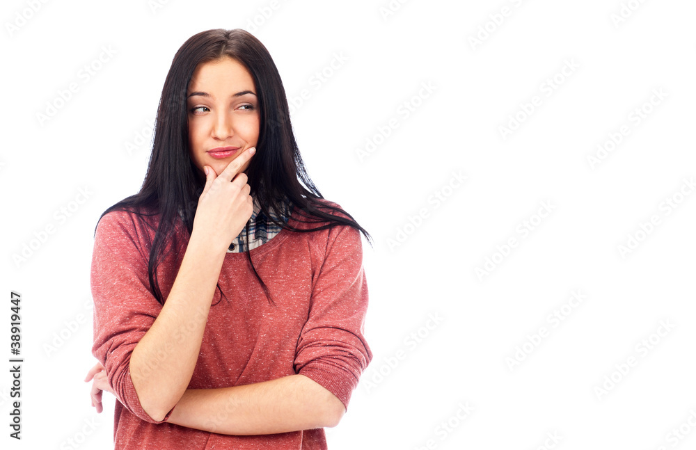 Beautiful young woman daydreaming with finger on chin Beautiful young woman daydreaming with finger on chin