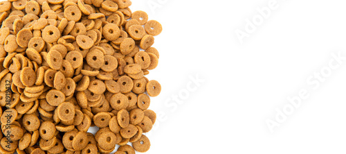 Professional dry pet food spread out on white background