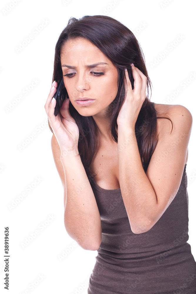 woman speaking at the phone looking worried woman speaking at the phone looking worried