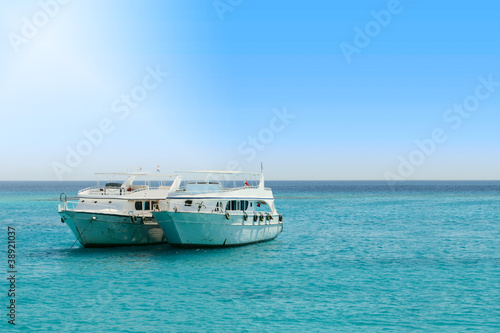 tourist boats in the middle of the sea © mitarart