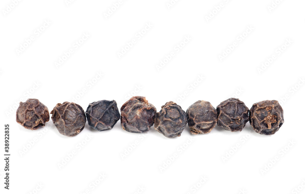 black pepper macro as isolation on white background black pepper macro as isolation on white background