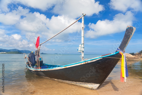 Long thai boat on sand beach