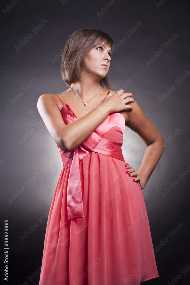 closeup portrait of brunette girl in pink dress closeup portrait of brunette girl in pink dress