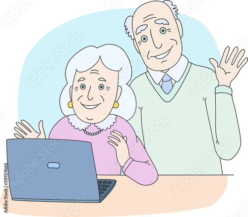 Senior couple using computer at home