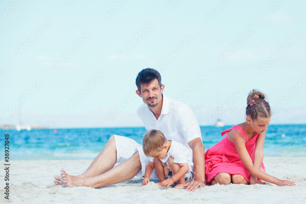 Cute father and her child playing at beach