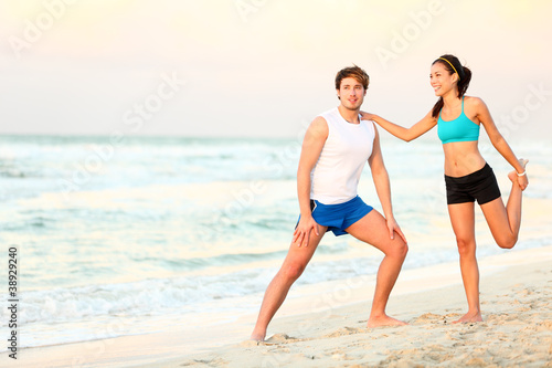 Couple workout training on beach