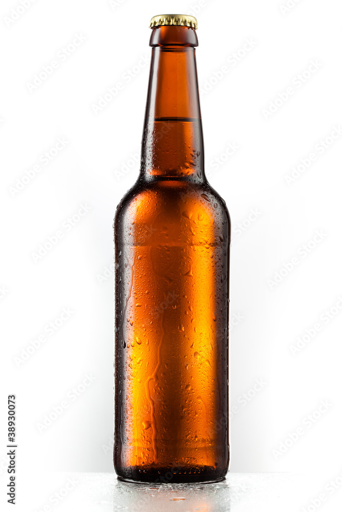 Bottle of beer with drops isolated on white background Bottle of beer with drops isolated on white background