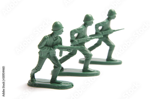 Three toy soldiers on a white background