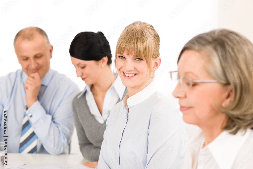 Businesswoman at team meeting with colleagues Businesswoman at team meeting with colleagues