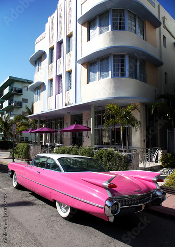 Old american car parked on Collins Avenue Miami Beach