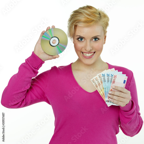 Pretty young woman saves money with her new software cd