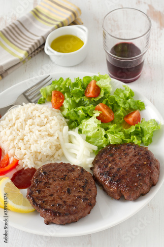 grilled hamburger with rice and salad