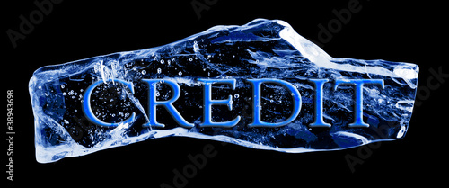 Word CREDIT frozen in the ice on a black background