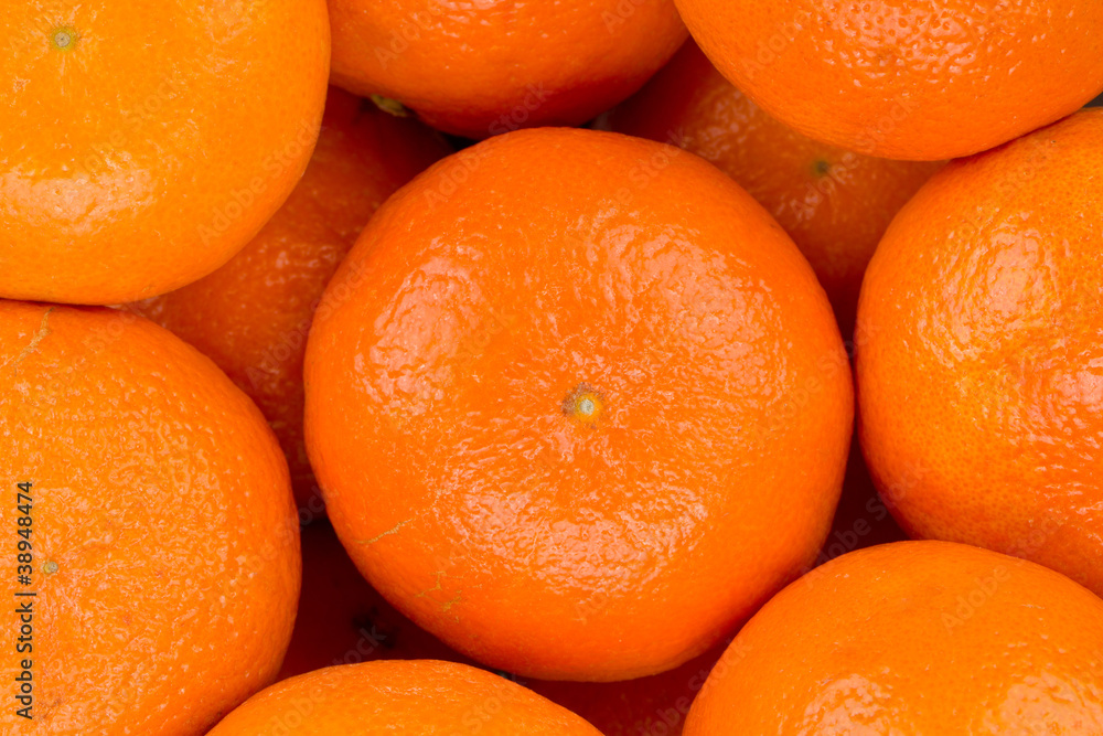 Ripe tangerine closeup background Ripe tangerine closeup background