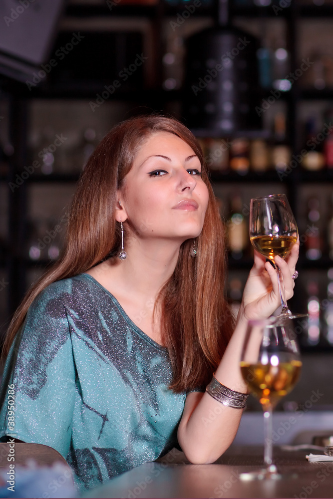 young woman with a glass of wine young woman with a glass of wine