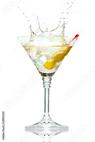 Olive splashing on martini glass isolated on white