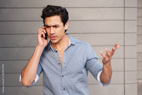 young businessman upset on phone