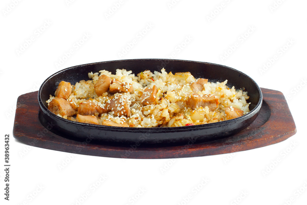 Rice and meat fried in a frying pan Rice and meat fried in a frying pan