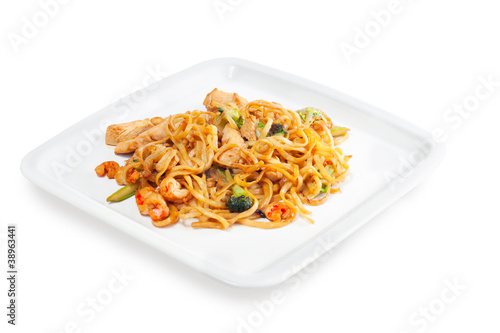 Spaghetti with seafood, meat and vegetables