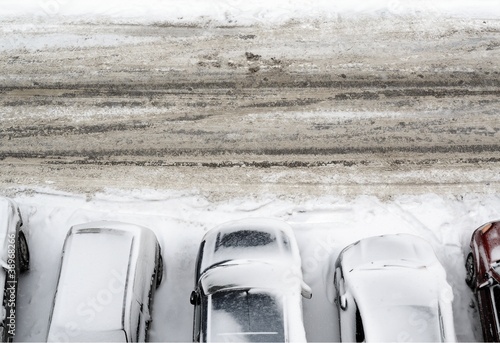 parking lot with cars covered in snow detail view from above photo