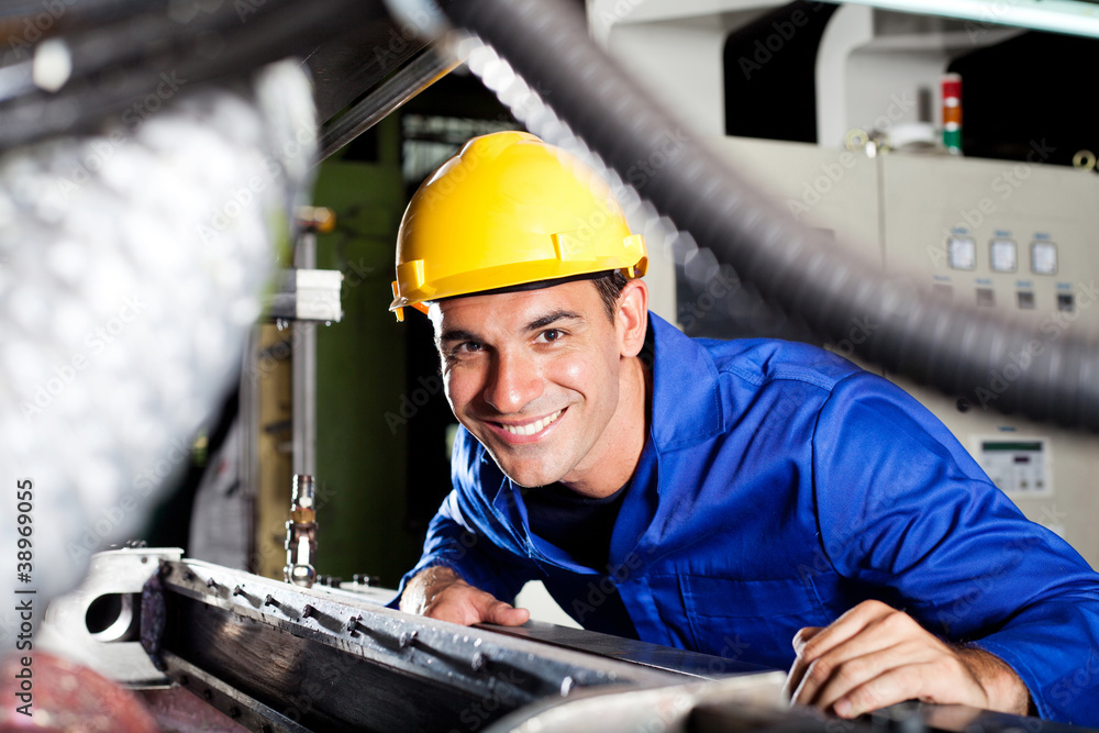 happy modern blue collar worker in factory happy modern blue collar worker in factory