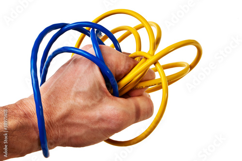 White male hand wrapped with blue and yellow patchcords.