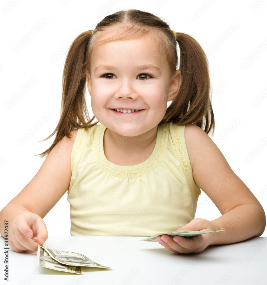Cute little girl with paper money - dollars Cute little girl with paper money - dollars