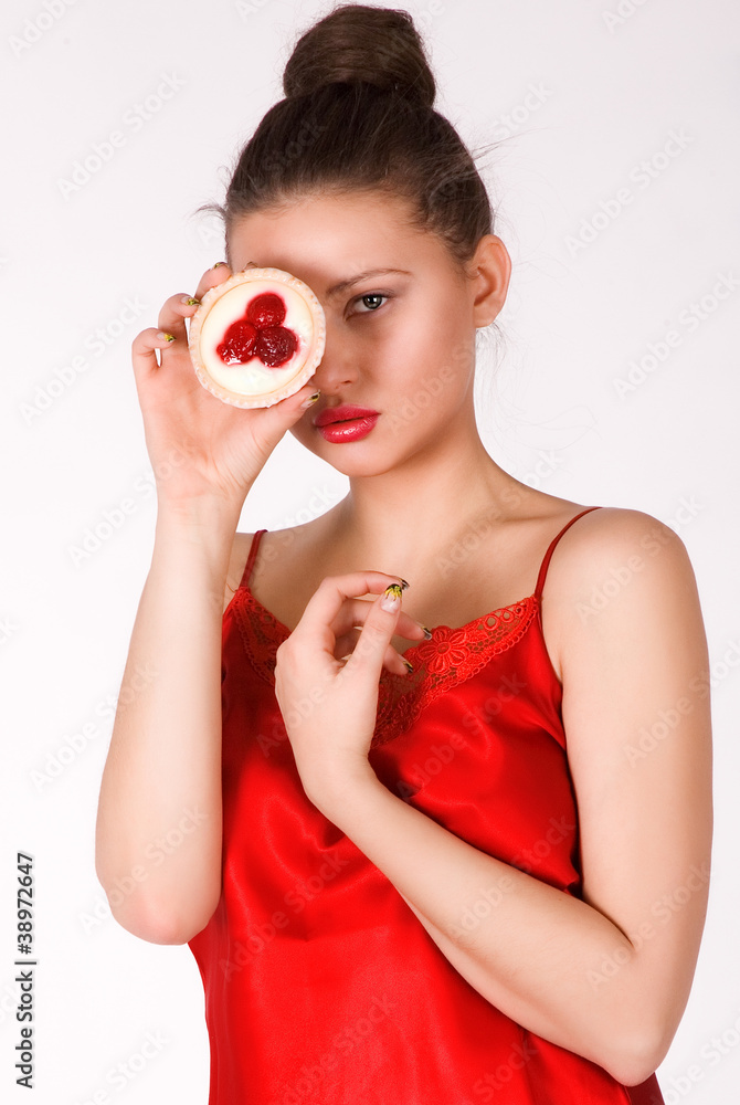 young beautiful girl with a cake on a white background young beautiful girl with a cake on a white background