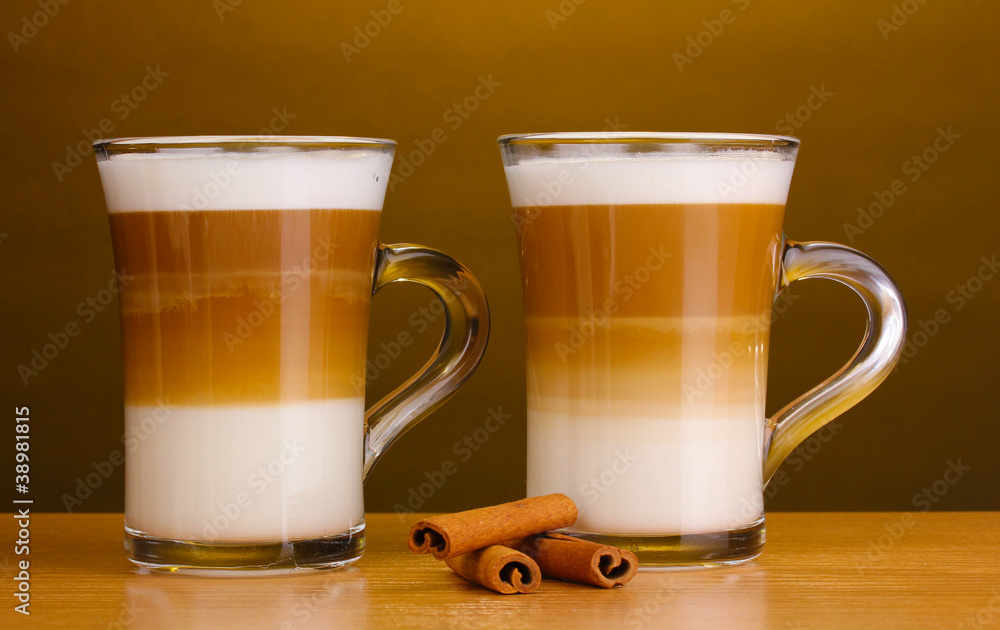 Fragrant сoffee latte in glass cups and cinnamon Fragrant сoffee latte in glass cups and cinnamon
