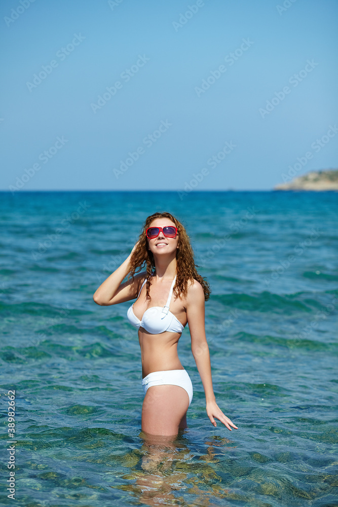 Naklejka premium Girl standing in water