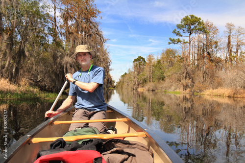 Man Paddling a Canoe - Okefenokee Swamp, Georgia