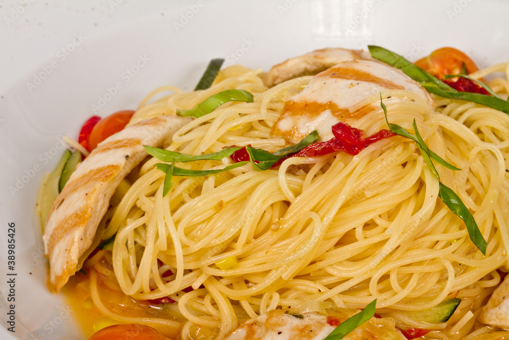 close-up of plate of pasta and chicken