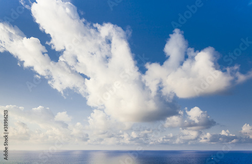 Sky with huge clouds and the sea