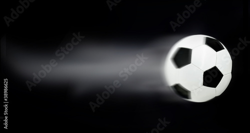 Fast soccerball leaving trails behind