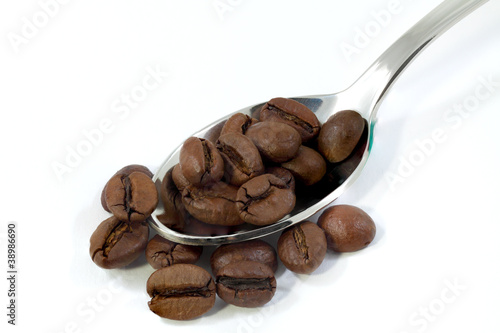 Spoon with coffee grains.