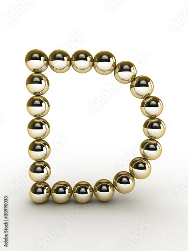 3d alphabet of gold beads.